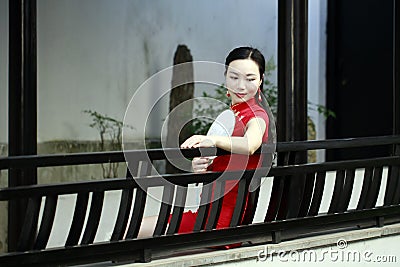 Chinese cheongsam model in Chinese classical garden Stock Photo